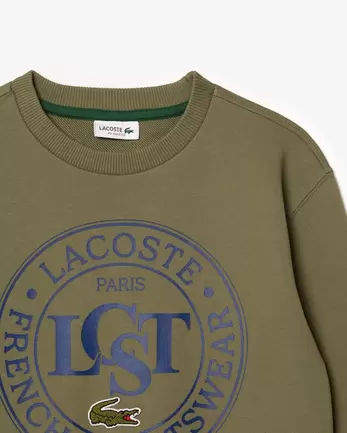 Sweatshirt mit Badge in Kontrastfarbe für 80€ in Lacoste