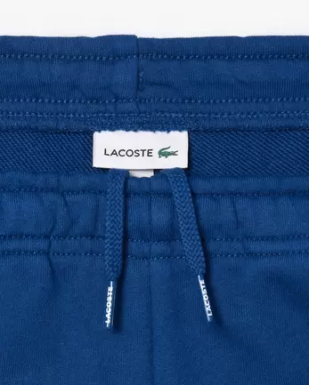 Trainingshose aus Vlies für 75€ in Lacoste